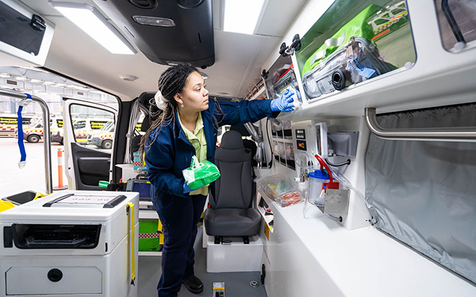 Make Ready Service staff member cleaning the inside of a NSW ambulance.
